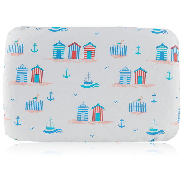 Soft waterproof rectangular bath pillow covered in a fun beach hut cotton print in reds and blues on white background. Two suckers on reverse.