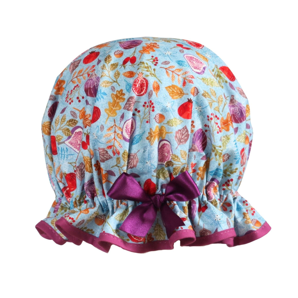 Vintage style women's roomy cotton shower cap. Frilled edge,fruit, nuts and berries on a blue background. Trimmed in rich plum with complementary bow.