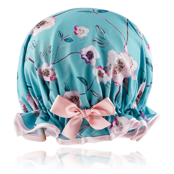 Retro style woman's frilled style shower cap.  Satin floral print on jade background with pink trim and satin bow.