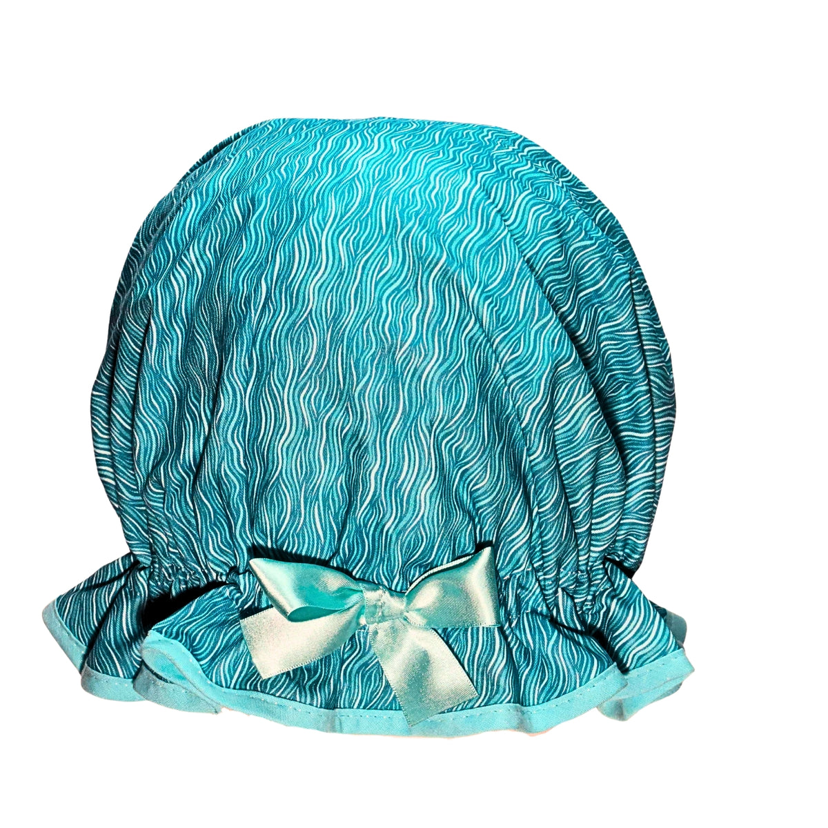 Vintage style women's roomy shower cap. Frilled edge, aqua and mint cotton ripples and waves print with cool aqua trim and matching satin bow.