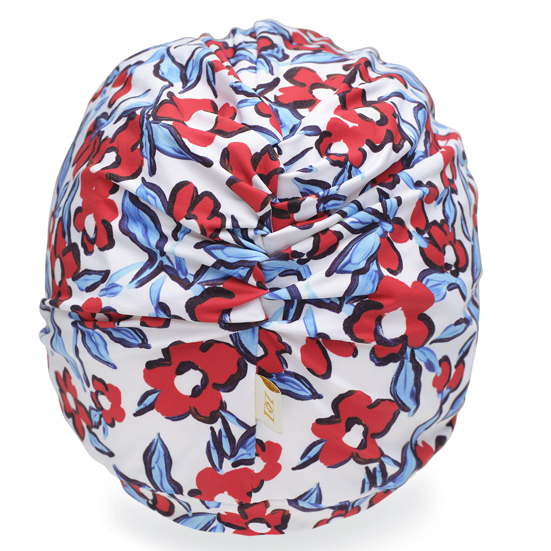 Rear shot of a red and blue floral patterned drying turban on a white background