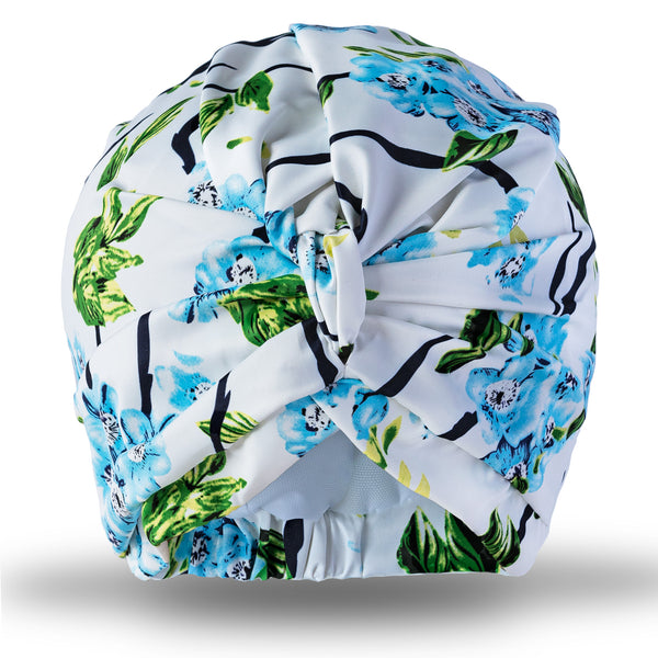 Pretty blue floral print shower turban made with a wonderfully soft stretch sateen.  Fits comfortably over your head whilst keeping the water out. Incredibly flattering to wear.   Ideal for showering in and pretty enough to wear swimming, or in the hot tub.