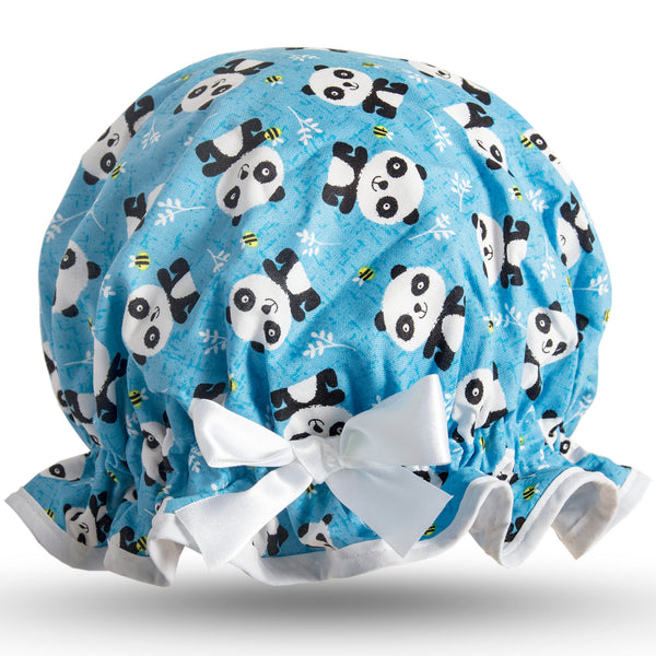 Vintage style kid's cotton shower cap. Frilled edge, cute panda print on blue background with white trim and bow.