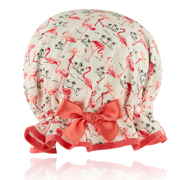 Vintage style kid's large cotton shower cap.  Frilled edge, pink flamingos with small black palm tree outline on ivory background.  Coral trim and matching satin bow.