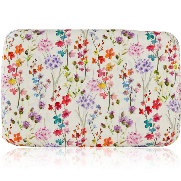Soft waterproof rectangular bath pillow covered in a cotton multicoloured floral print. Suckers on reverse.