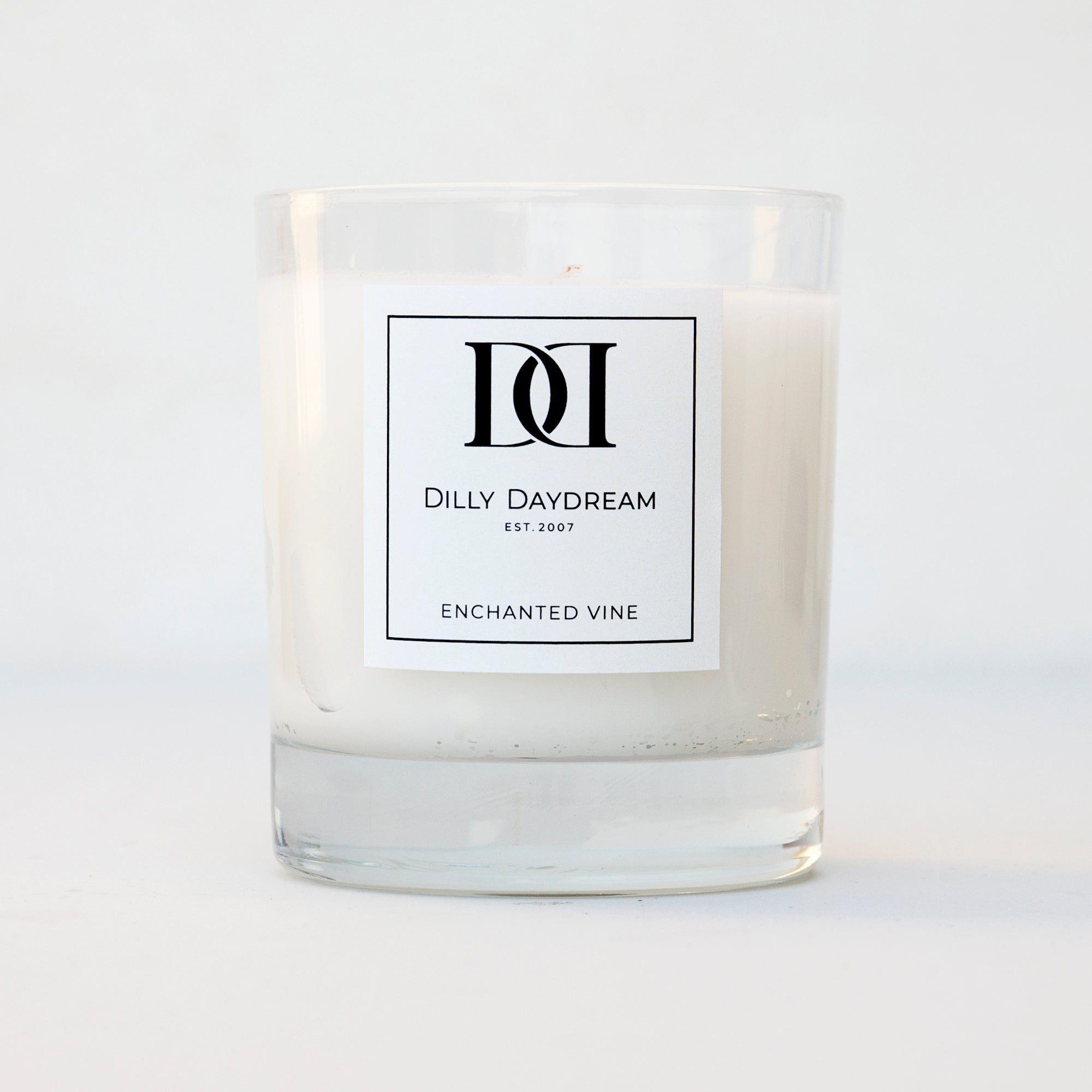 Candle in clear glass tumbler