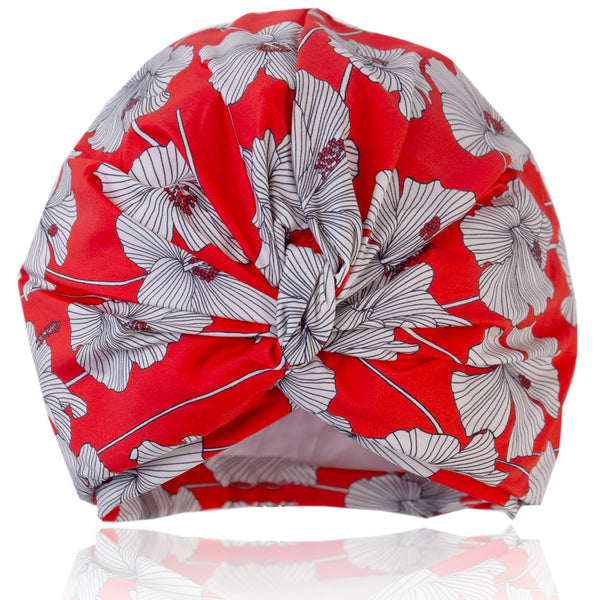 Cream and red hibiscus print lycra pull on waterproof shower turban, with pretty gathered knot at front.