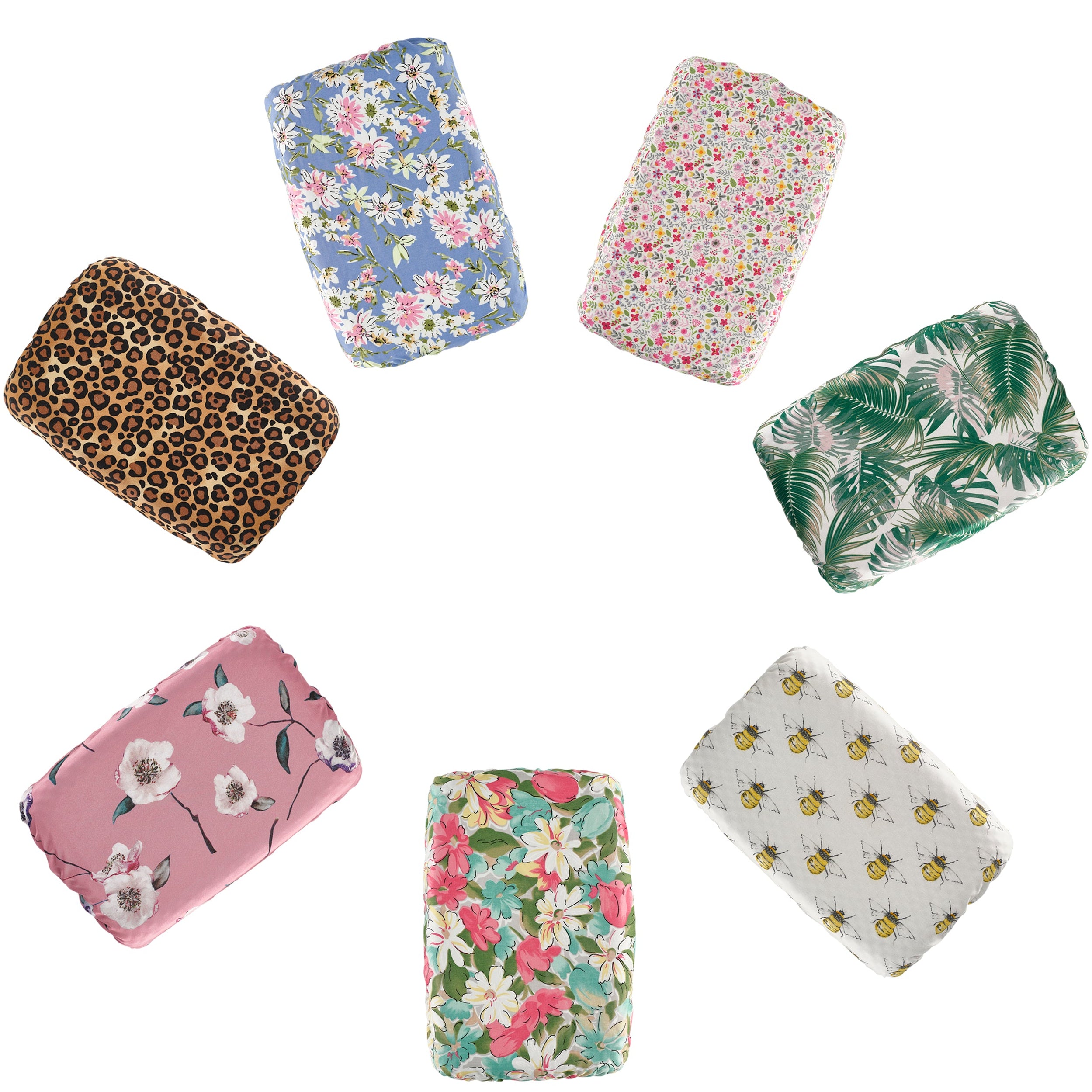 Collection of various patterned bath pillow covers on a white background