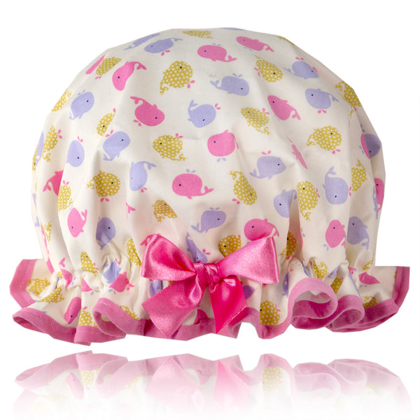 Vintage style, kids cotton shower cap,  Frilled edge, pink, lilac, yellow spouting whales on an ivory background. Pink trim and matching satin bow.