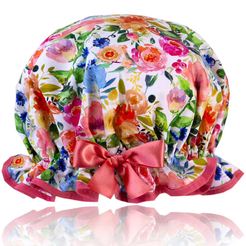 Vintage style, women's large cotton shower cap.  Frilled ege,  bright bold multi-coloured floral print trimmed in peach cotton and matching satin bow.