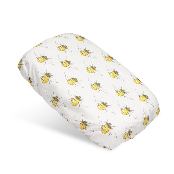 Soft waterproof rectangular bath pillow covered in a bee cotton print on ivory background.  Two suckers on reverse.
