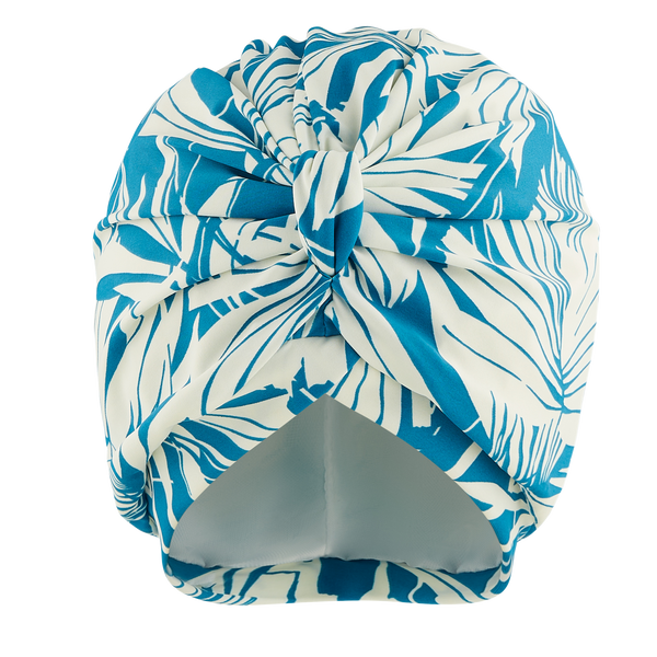 Blue and white palm stretch lycra print pull on turban, with pretty gathered knot at front

