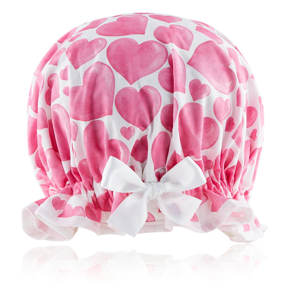 Retro style women's shower cap with pink bubbly hearts on white background.  Frilled edge, with white trim and matching satin bow.
