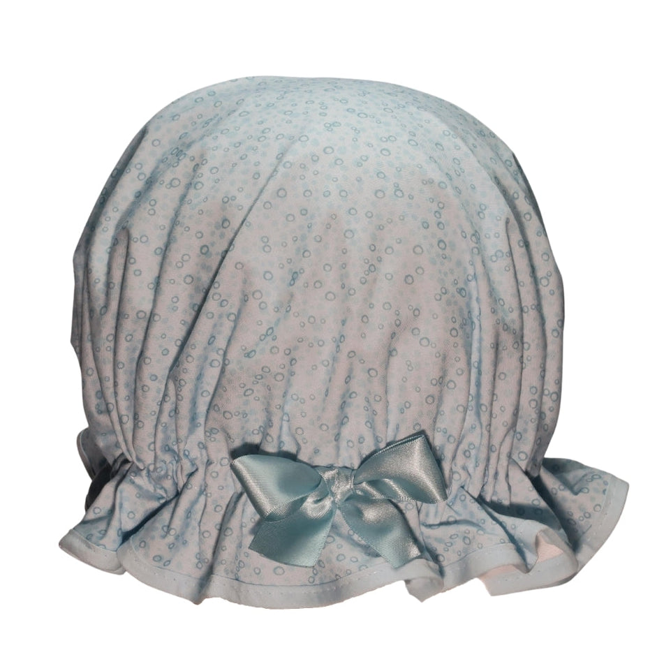 Vintage style women's roomy cotton shower cap. Frilled edge, blue bubble print, trimmed with a matching edge and bow.