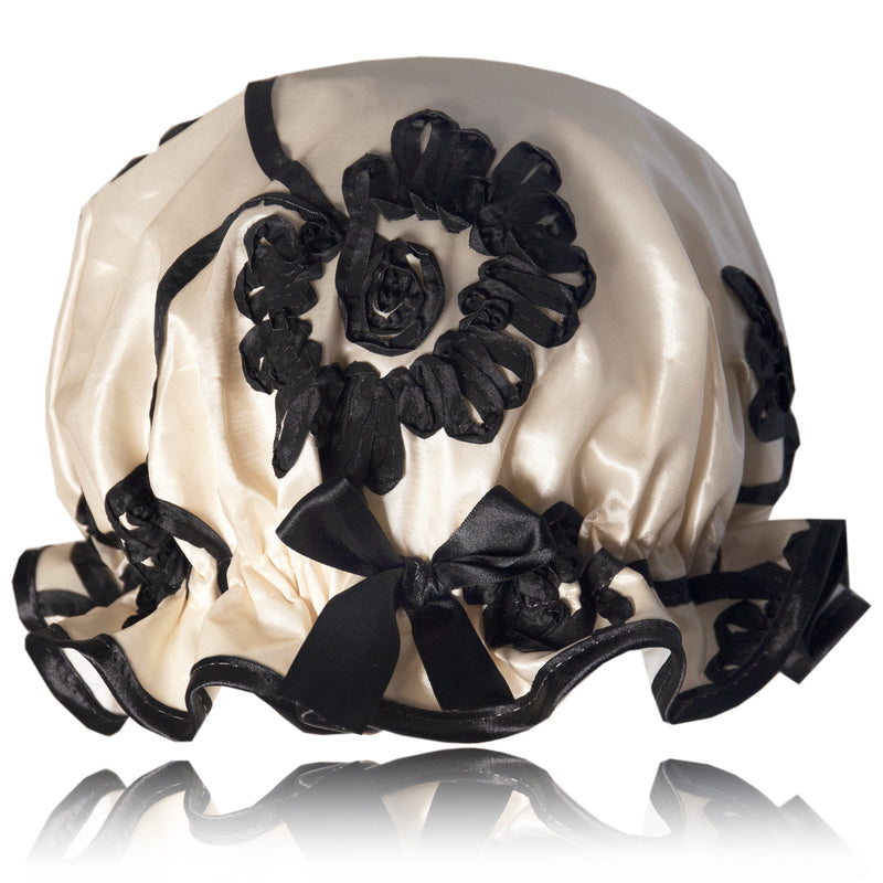 Vintage style women's taffeta shower cap.  Black swirly ribbons on a rich cream background. Trimmed in black with matching satin bow.