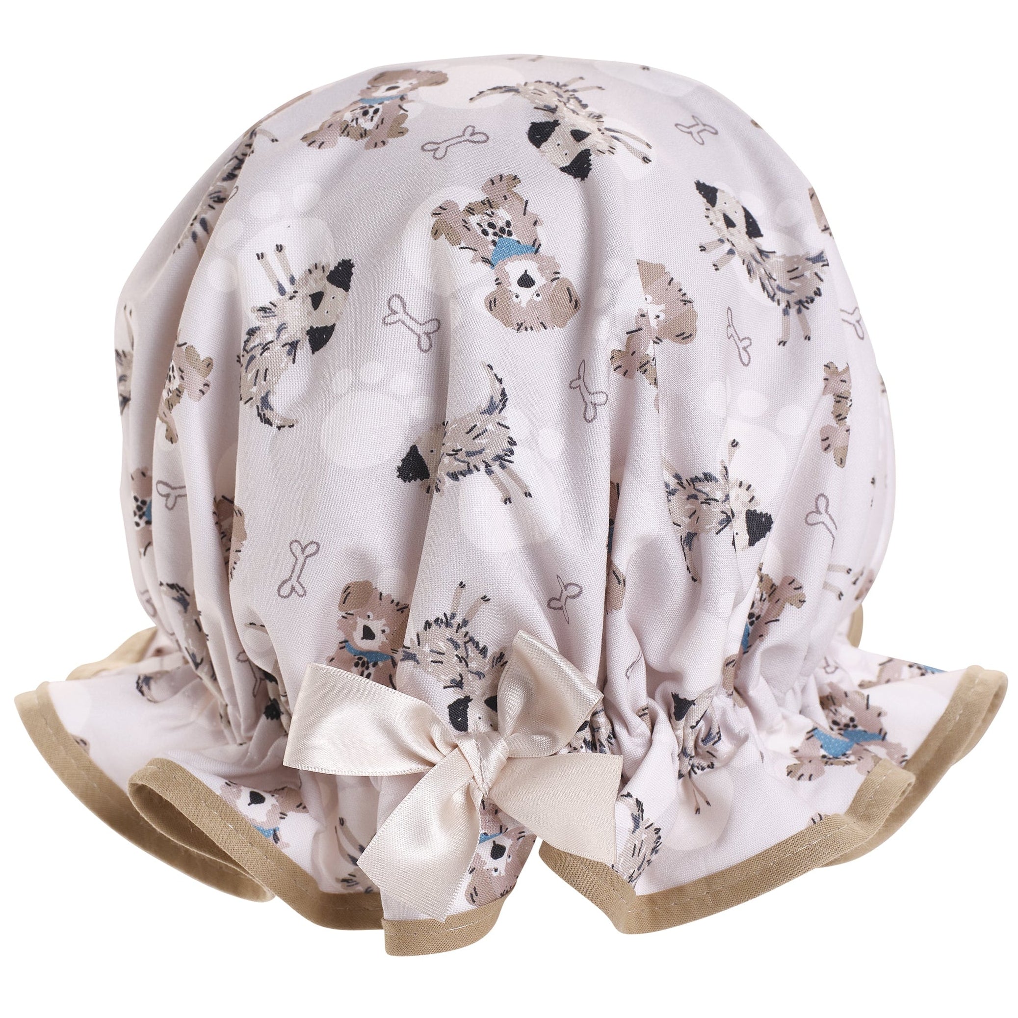 Vintage style women's roomy cotton shower cap.  Frilled edge, cute dog and bone print on a pale beige background with a sandy trim and bow.