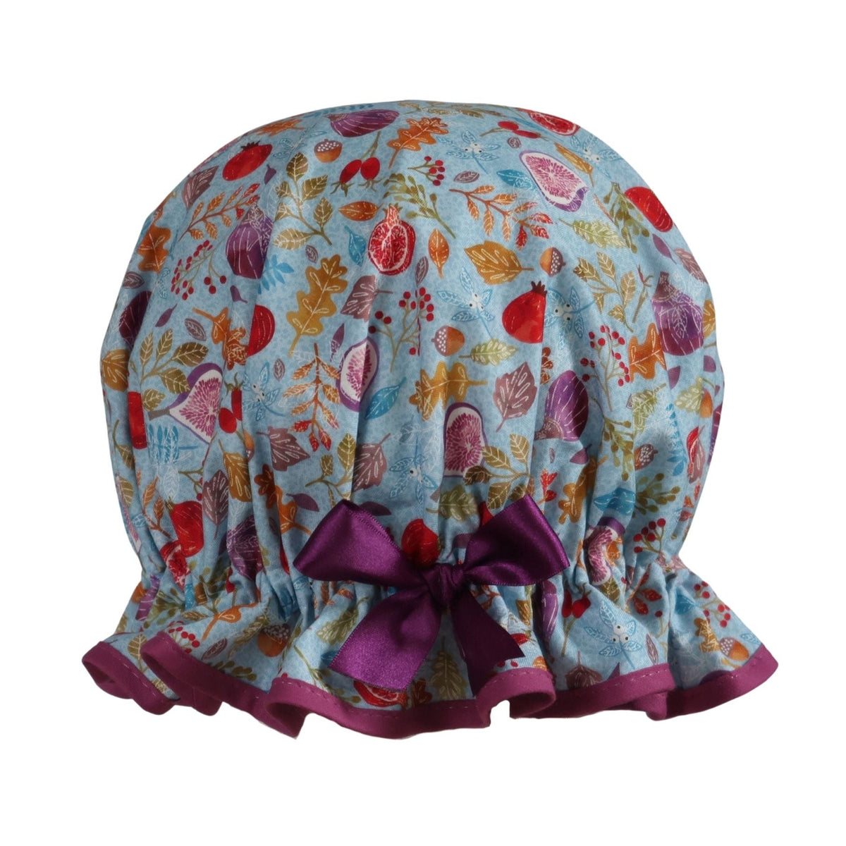 Vintage style women's roomy cotton shower cap.  Frilled edge,fruit, nuts and berries on a blue background. Trimmed in rich plum with complementary bow.