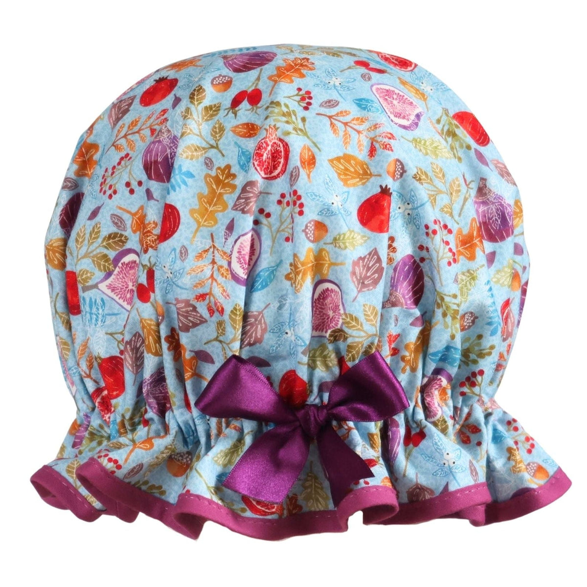 Vintage style women's roomy cotton shower cap.  Frilled edge,fruit, nuts and berries on a blue background. Trimmed in rich plum with complementary bow.