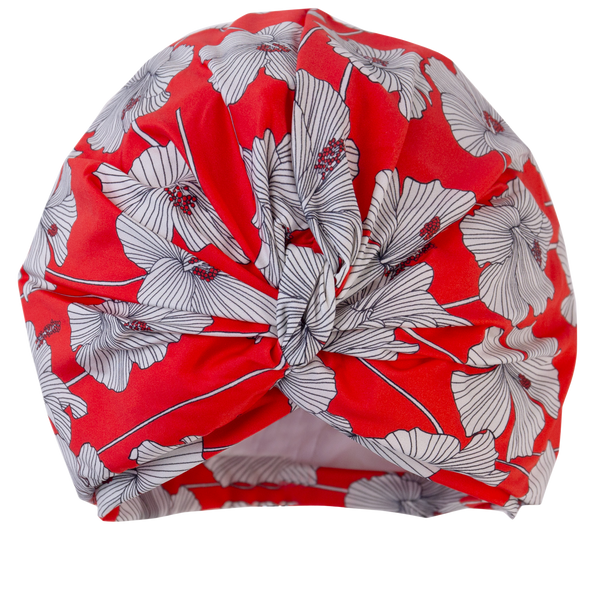 Cream and red hibiscus print lycra pull on turban, with pretty gathered knot at front.