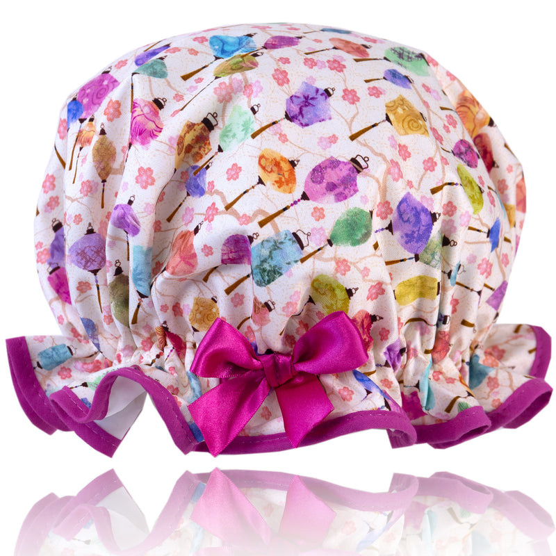 Vintage style, women's large cotton shower cap.  Frilled edge, multi-coloured paper lantern print trimmed in warm pink and matching satin bow.
