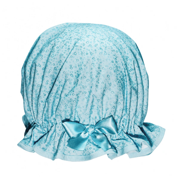 Product shot of a fresh blue bubble print shower cap with with frill, matching trim and satin bow.