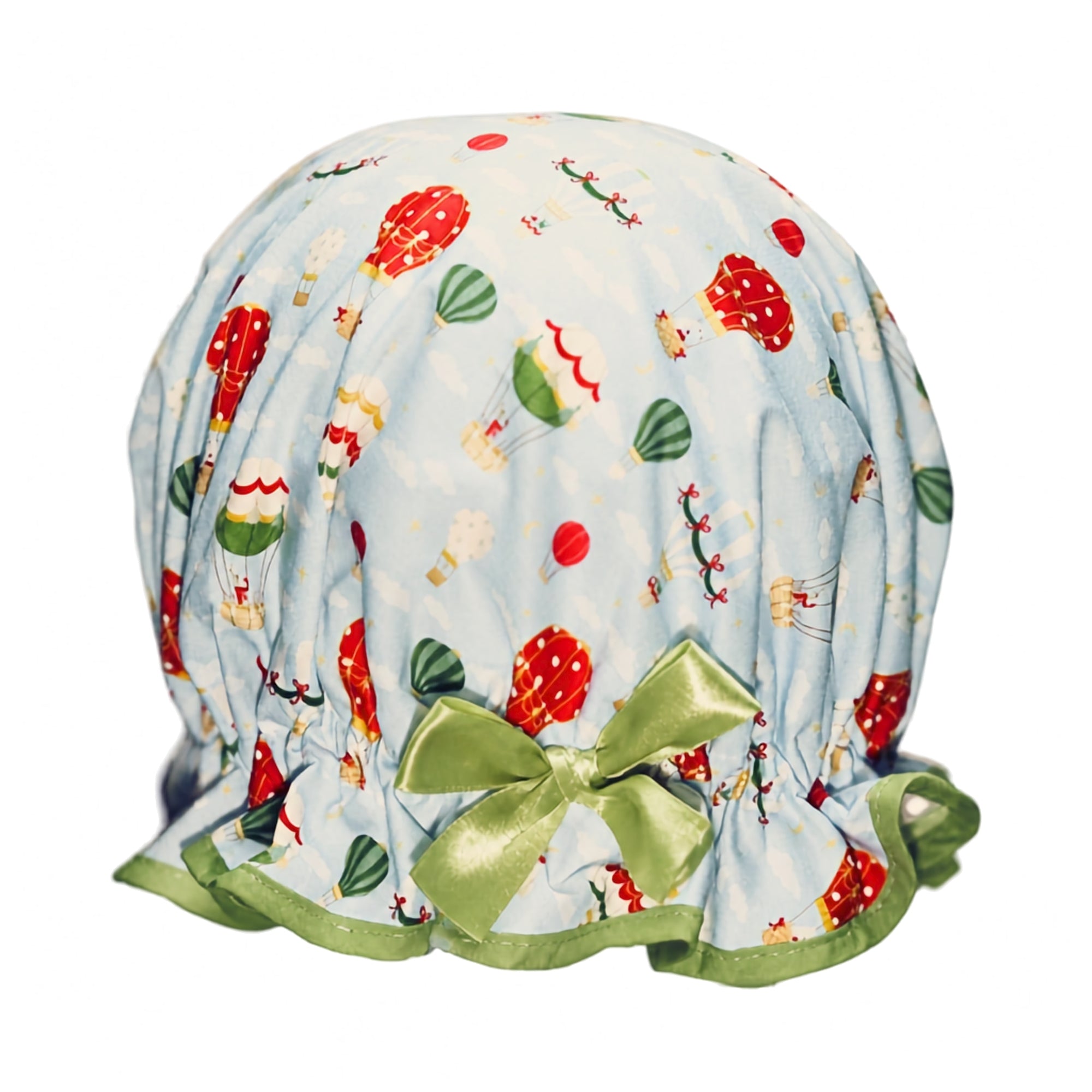 Vintage style, women’s large cotton shower cap. Frilled edge, sky blue background with fun green, red and cream hot air balloons carrying rabbits and polar bears.  Trimmed in soft green with matching satin bow.
