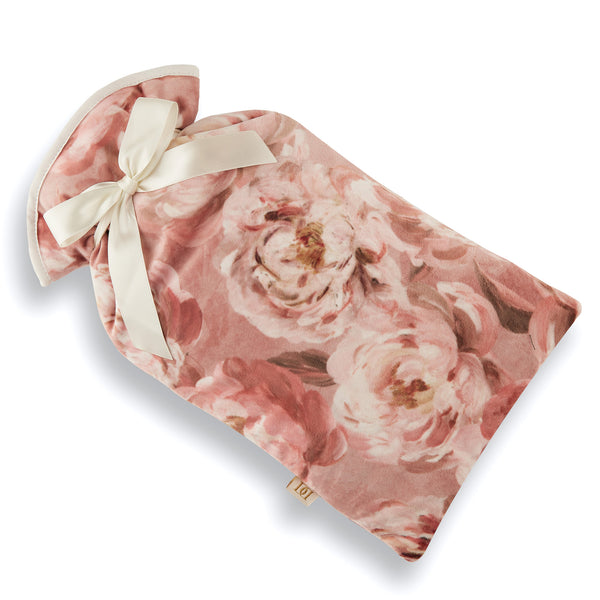 Pale pink and cream peony velvet print hot water bottle cover with cream trim and ribbon bow.  2 litre cream hot water bottle included.