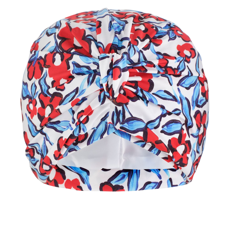 Colourful blue and red floral-patterned jersey lined drying turban on a white background. Pretty knot at front.