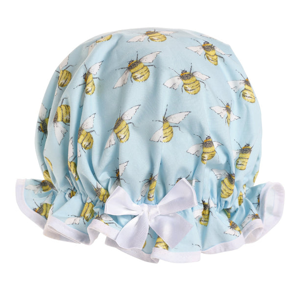 Vintage style women's large cotton shower cap.  Frilled edge, symmetric bee print on pale blue background with white trim and bow.
