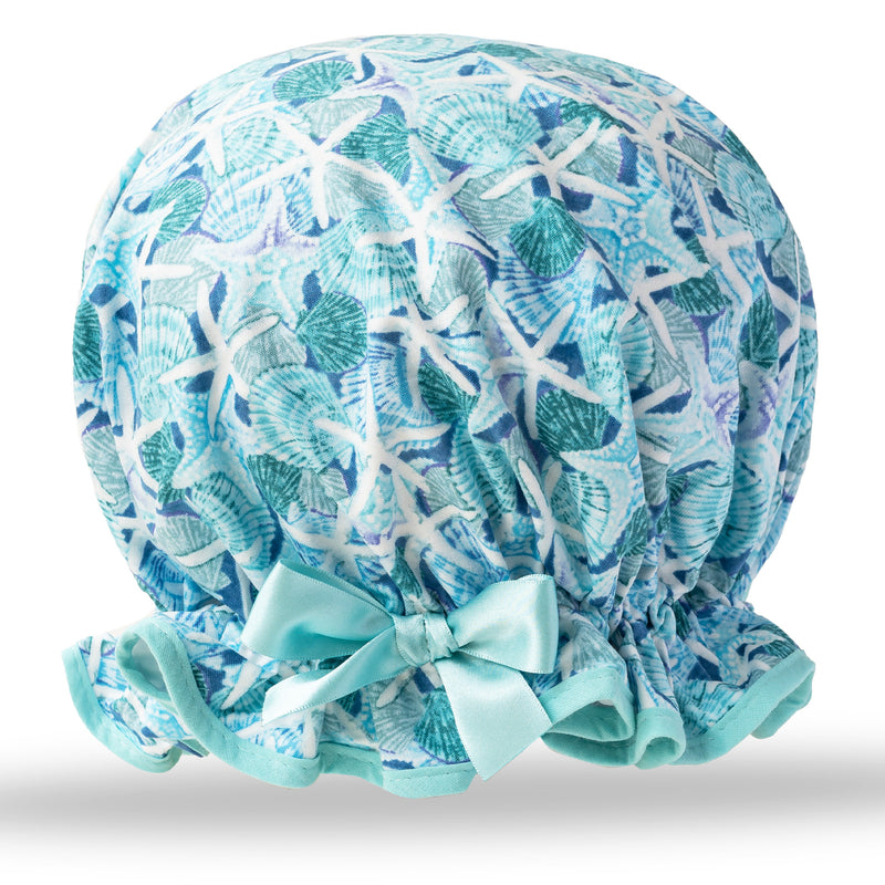 Vintage style women's large cotton shower cap.  Frilled edge, blue and green sea shells and white and blue starfish print in cotton. Complimentary aqua trim and satin bow.