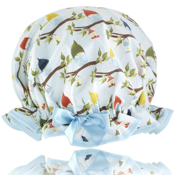 Vintage style, women's large cotton shower cap.  Frilled edge, multicoloured owl print in blue, green, brown and yellow. Trimmed in pale blue with matching satin bow.