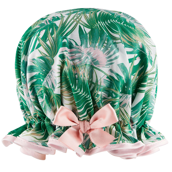 Retro style woman's frilled style shower cap.  Satin print of palm leaves in green and pink hues, with pale pink trim and satin bow.