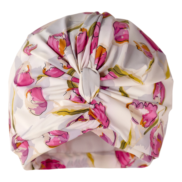 Pink tulip print on white lycra background pull on drying turban, with pretty gathered knot at front
