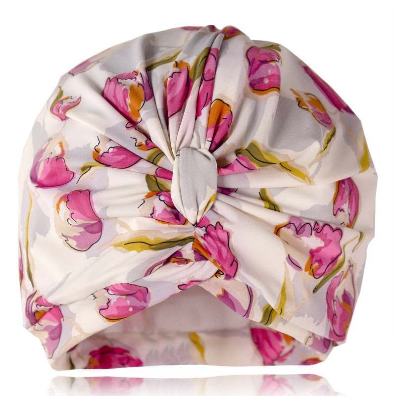 Pink tulip print on white lycra background pull on bamboo jersey lined drying turban, with pretty gathered knot at front
