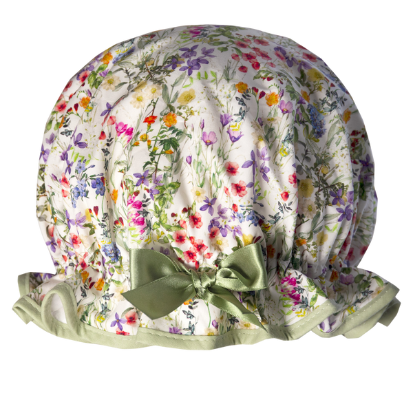 Vintage style, women’s large cotton shower cap. Frilled edge, multicoloured meadow floral print on a white background.  Trimmed in sage green with matching satin bow.