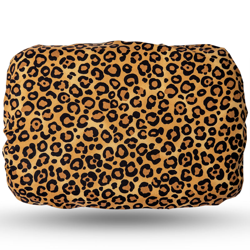 Soft waterproof rectangular bath pillow covered in a cotton animal print. Suckers on reverse.