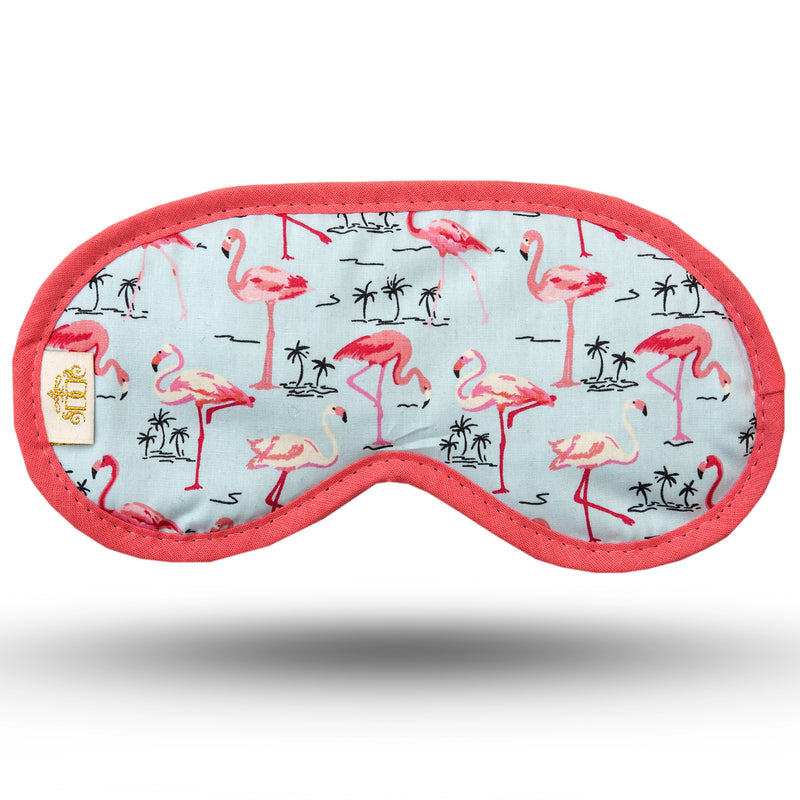 Pink flamingo and small black palm trees on pale blue background cotton print sleep mask.  Soft black velvet velour backing and elastic.  Edged in salmon pink.