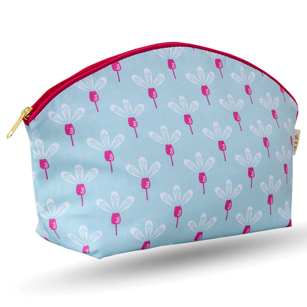 Curved zip top cotton sponge bag.  Pink and white flowers on a sky blue background. Trimmed in cerise with matching zip.