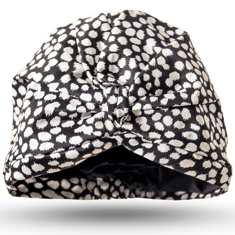Small white white splodges on black cotton spandex pull on waterproof turban, with pretty gather and knot at front