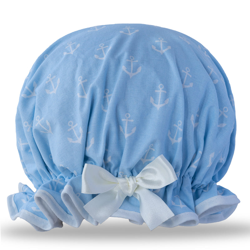 Vintage style women's large cotton shower cap.  Frilled edge, white anchor repeat print on sky background with pale ivory trim and satin bow.