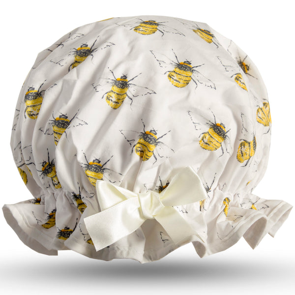 Vintage style women's large cotton shower cap.  Frilled edge, symmetric bee print on ivory background with ivory trim and bow.