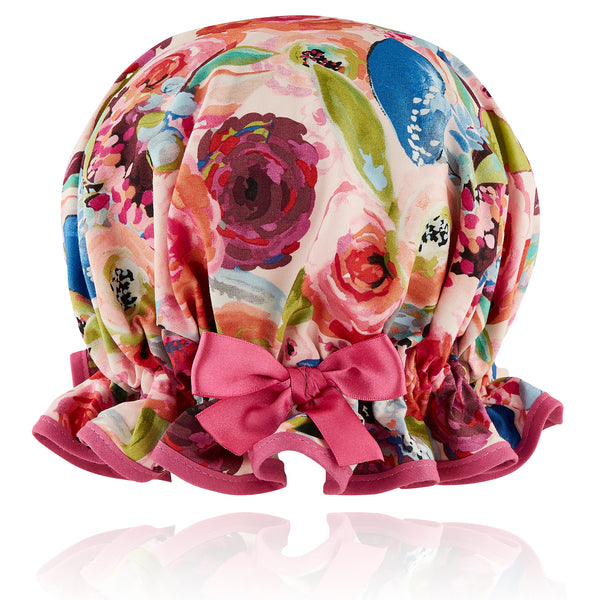 Vintage style, women's large cotton shower cap.  Frilled edge, bold large flower print in pink purple green, orange and blue on pale pink background. Trimmed in warm pink with matching pink satin bow.