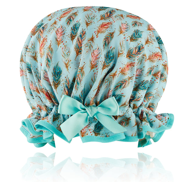Vintage  style women's large multi coloured feather print cotton shower cap on pale blue background. Frilled edge, aquamarine trim and satin bow.