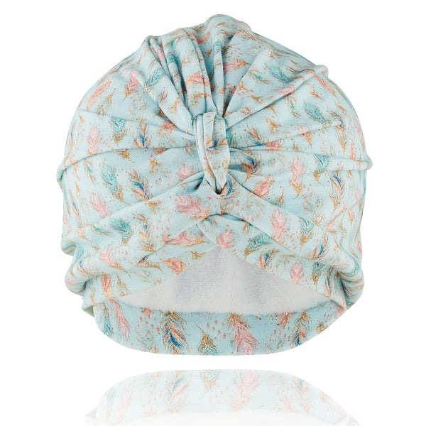 Multi coloured feather on pale blue background jersey print pull on towelling lined turban, with pretty gather and knot at front.