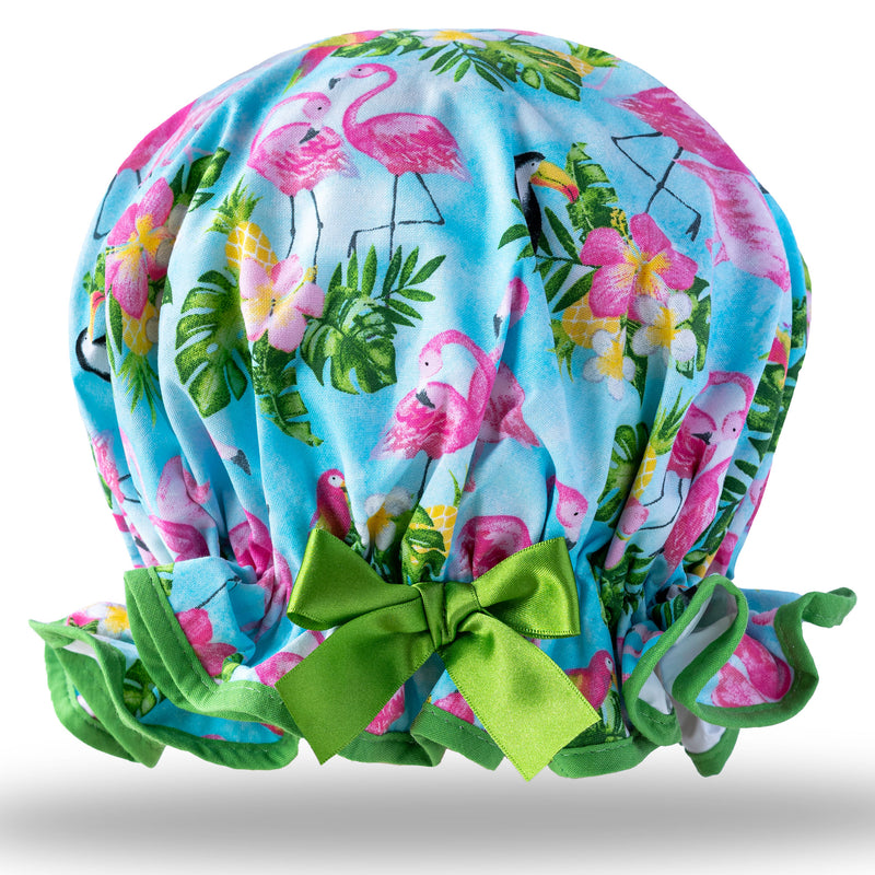 Vintage style women's large cotton shower cap.  Frilled edge, bright blue, green and pink flamingo and palm leaf print with green trim and satin bow.
