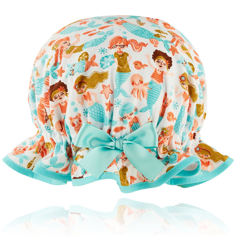 Vintage style kid's cotton shower cap.  Frilled edge, fun blue and coral mermaid cotton print with underwater sea creatures .  Aqua trim and satin bow.