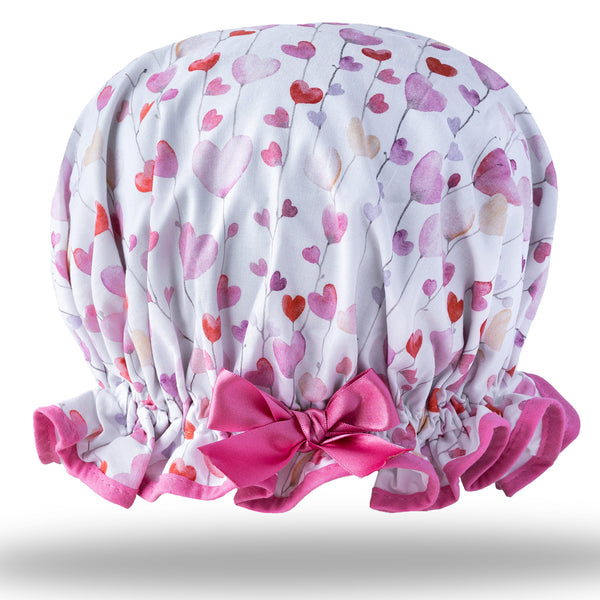 Vintage style women's large cotton shower cap.  Frilled edge, delicate floating pink and red heart print on white background with pink trim and matching satin bow