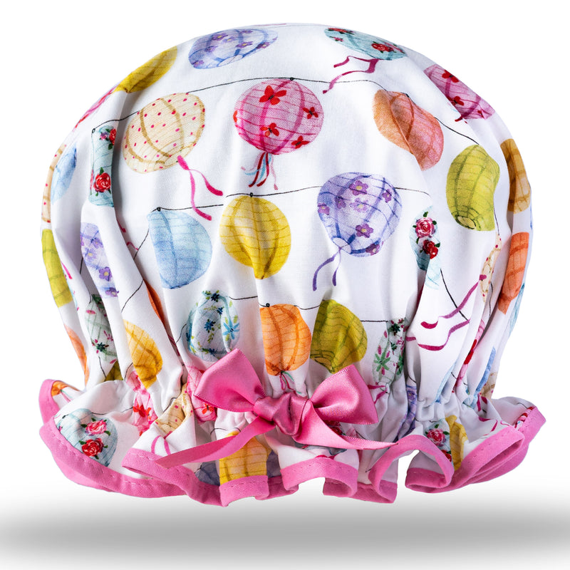 Vintage style women's large cotton shower cap.  Frilled edge, multi-coloured cotton print with chinese paper lanterns on an ivory background.  With pink trim and satin bow.