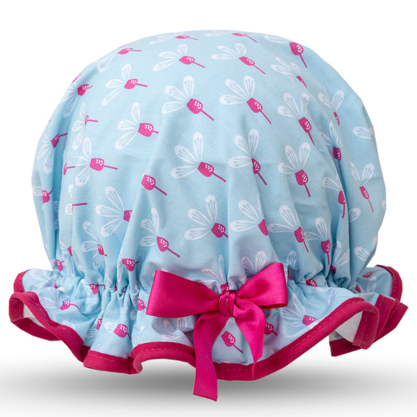 Vintage style women's large cotton shower cap.  Frilled edge, pink and white flowers on a sky blue background, cerise trim and bow