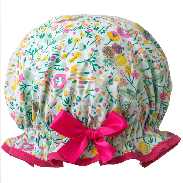 Vintage style women's large cotton shower cap.  Frilled edge, multicoloured flowers and smalled birds on a pale green background, hot pink trim and bow